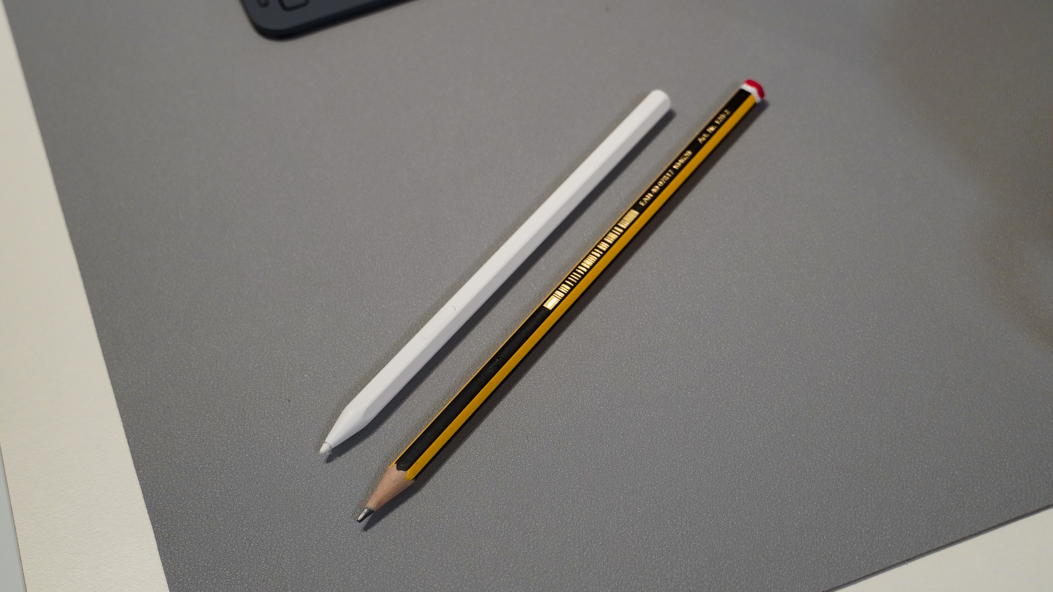 The new S Pen for tablets (left) compared to a regular pencil (right).