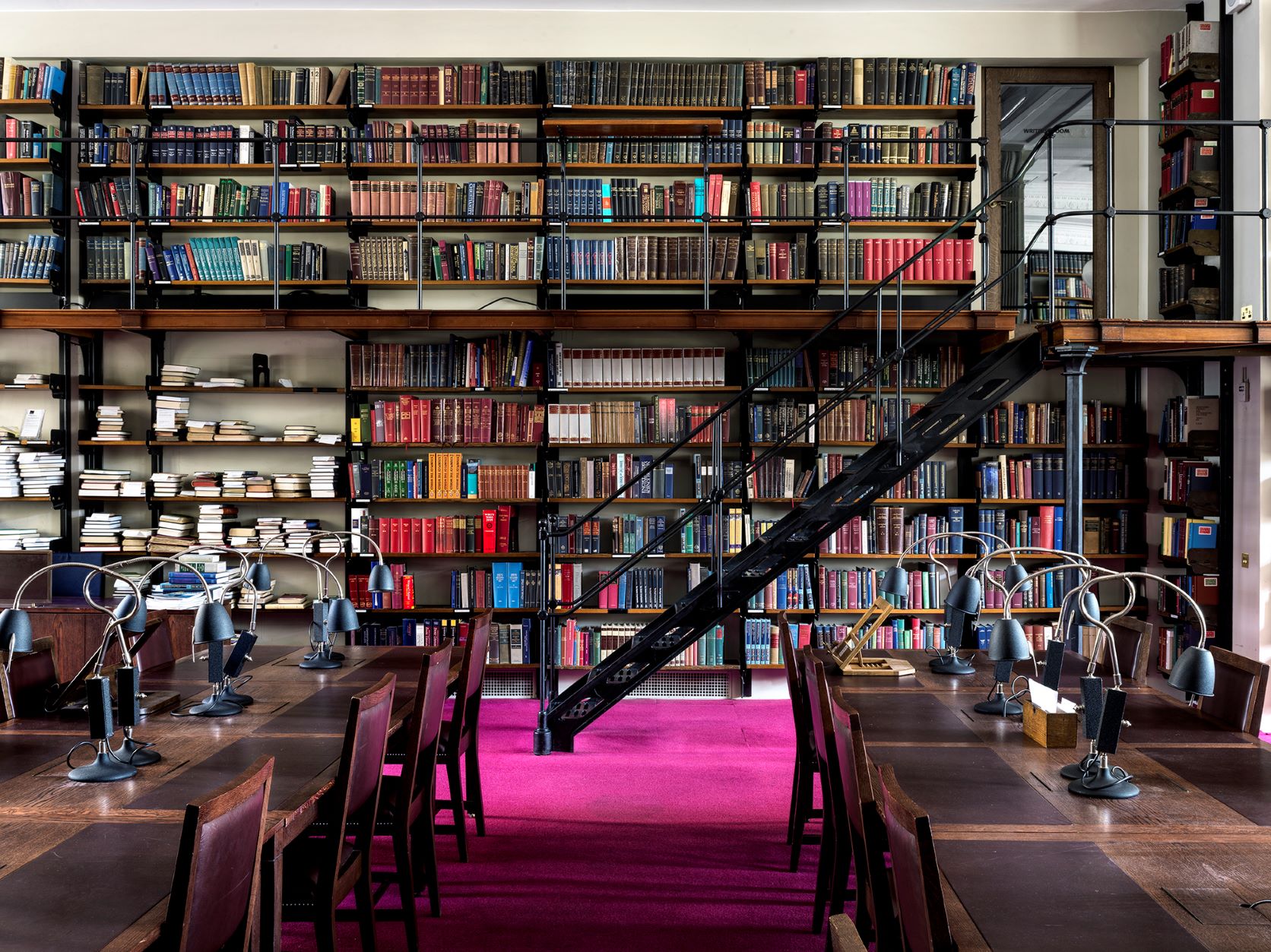 Inside a pink carpeted library