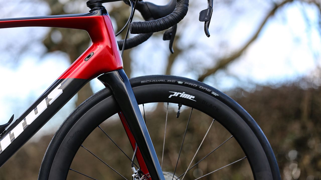 The fork crown tucks into the down tube of the frame for improved aerodynamics