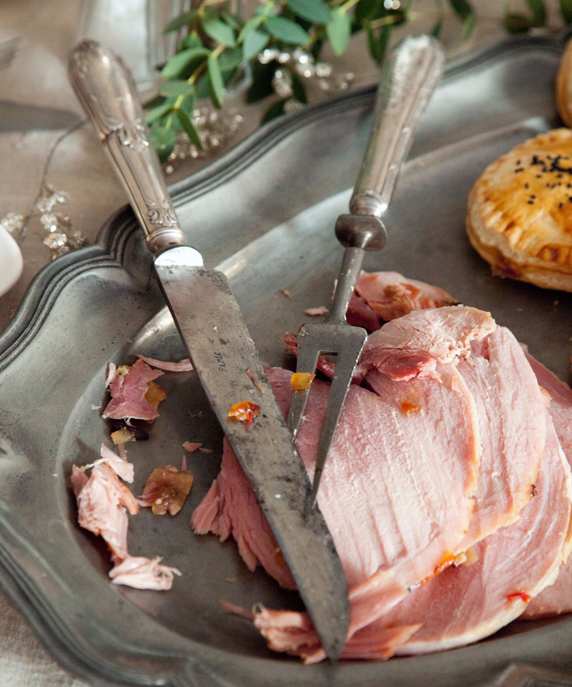Christmas ham sliced on a silver platter