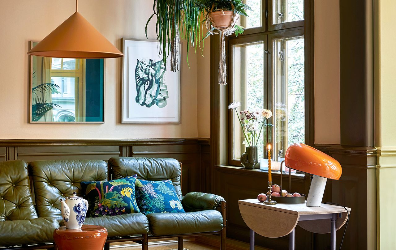 green, brown and orange living room with green couch