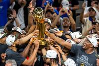 SAN ANTONIO, TEXAS - JUNE 13: New York Knicks players celebrate while receiving the Larry O'Brien Championship Trophy after defeating the San Antonio Spurs 94-90 in Game 5 of the NBA Finals at Frost Bank Center in San Antonio on Saturday, June 13, 2026. (Katina Zentz/San Antonio Express-News via Getty Images)