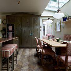 Green shaker kitchen with cupboard hat