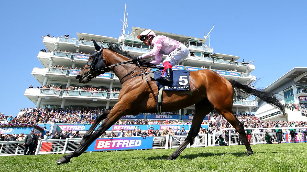 Emily Up John ridden by Frankie Dettori (pink and white silks) wins the Dahlbury Coronation Cup during Ladies Day of the Derby Festival at Epsom Downs Racecourse on June 02, 2023 in Epsom, England.