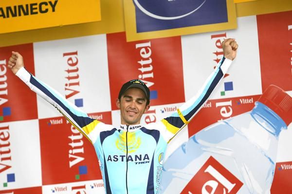 Alberto Contador revels in his podium apperance for winning the Annecy time trial.