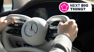 Two hands holding a steering wheel with Mercedes-Benz steer-by-wire tech
