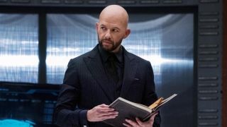 Jon Cryer as Lex Luthor holding the Book of Destiny in Crisis on Infinite Earths crossover