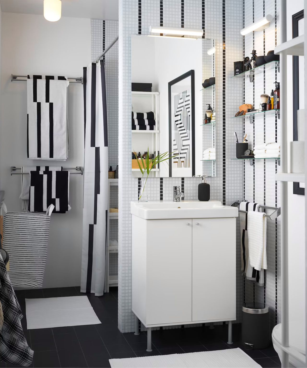 Small bathroom with white dressing table and monochrome accessories