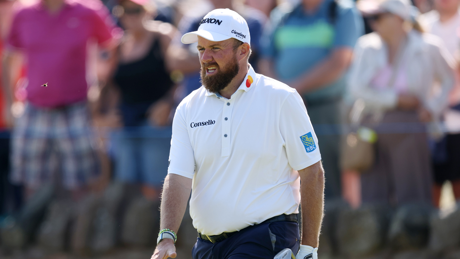 Shane Lowry walks up to the green with a wedge in his hand