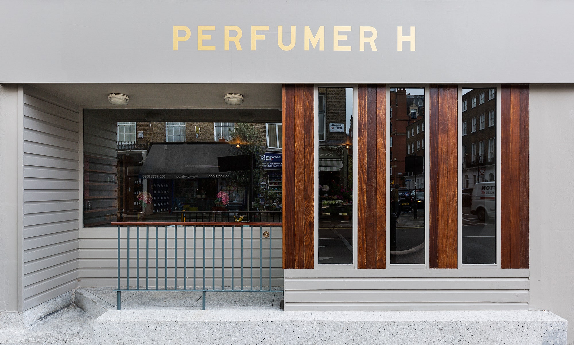 grey shop facade with gold lettering