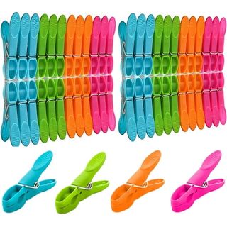 A set of multi-colored plastic clothes pegs