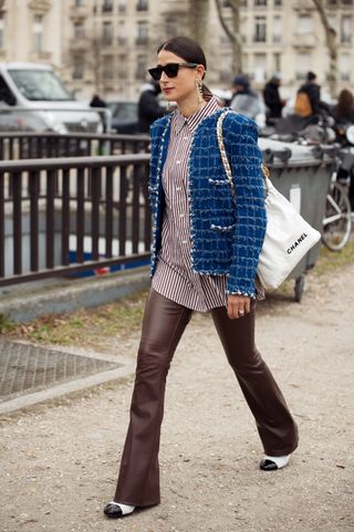 a woman wears cap-toe shoes in Paris