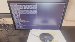 An optical gaming mouse hooked up to a screen recording sound data