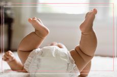 Baby in a nappy with legs in the air to illustrate baby constipation