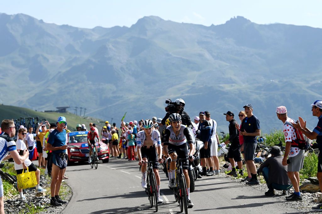 COURCHEVEL FRANCE JULY 19 LR Tadej Pogacar of Slovenia White Best Young Rider Jersey and Marc Soler of Spain and UAE Team Emirates compete climbing to the Col de la Loze 2300m while fans cheer during the stage seventeen of the 110th Tour de France 2023 a 1657km at stage from SaintGervais MontBlanc to Courchevel UCIWT on July 19 2023 in Courchevel France Photo by Tim de WaeleGetty Images