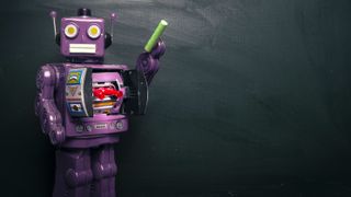 Robot toy in front of chalk board