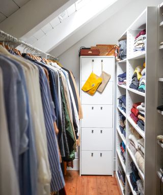 Small closet with clothes rail and shelving