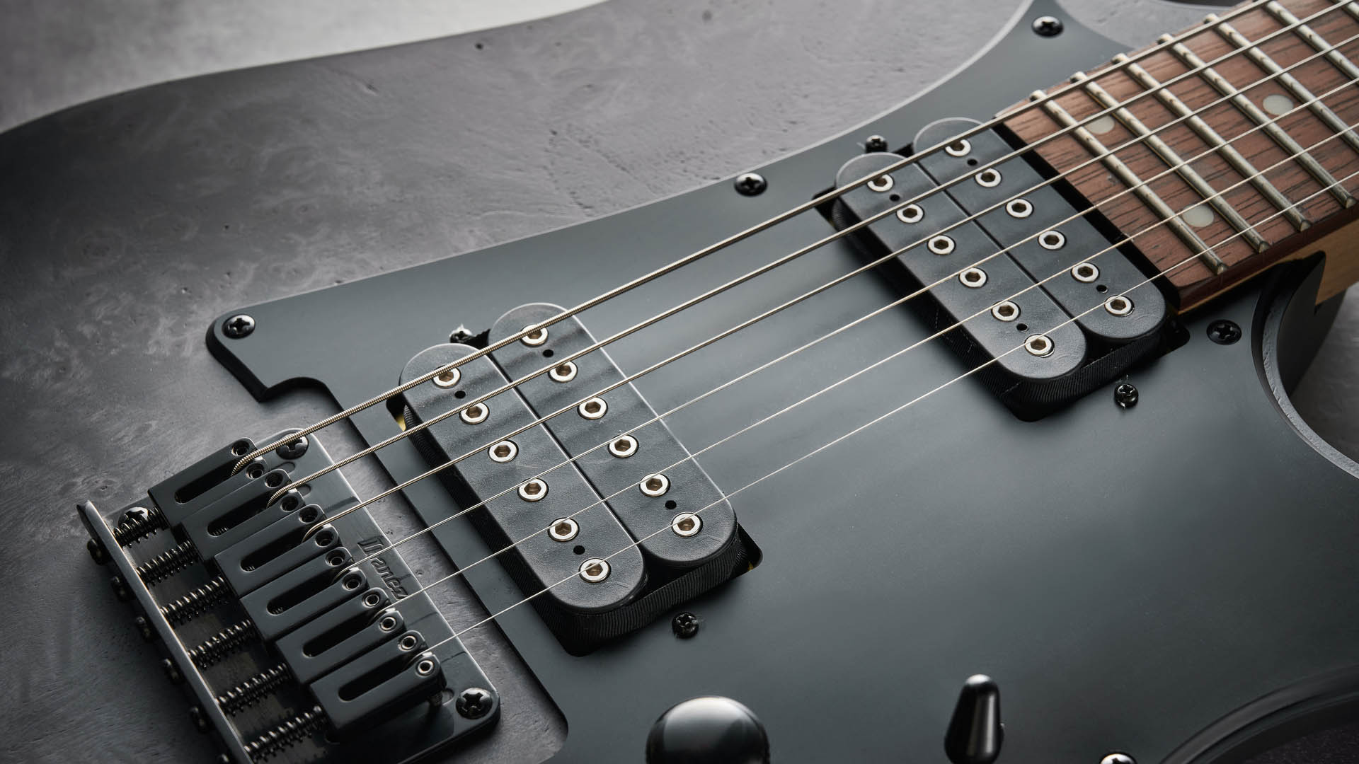 The Ibanez Standard Series RGR431PB finished in Charcoal Gray Flat