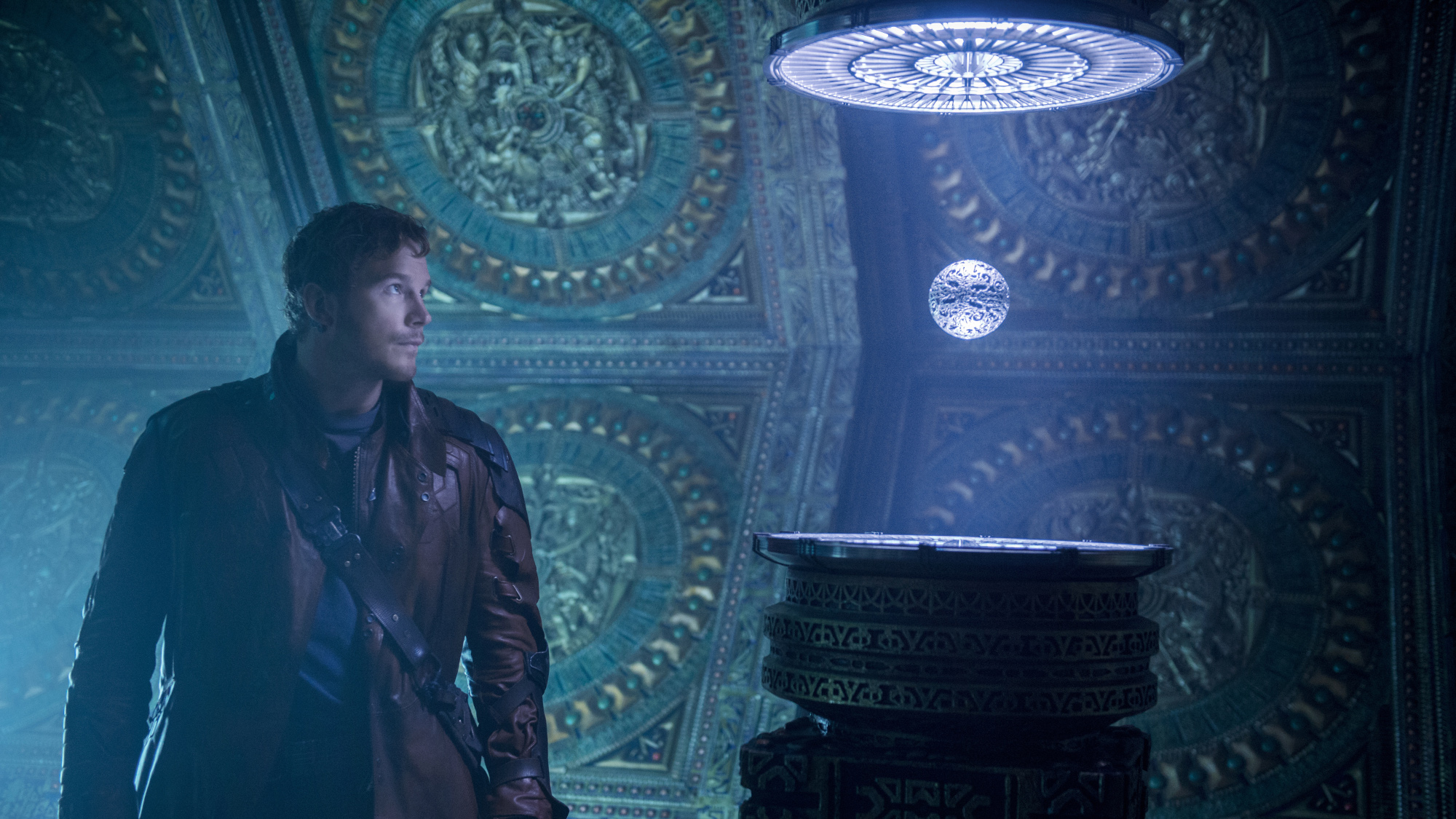 Peter Quill (Chris Pratt) looks at the Orb in Guardians of the Galaxy.