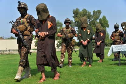 Afghan security forces transport Taliban prisoners