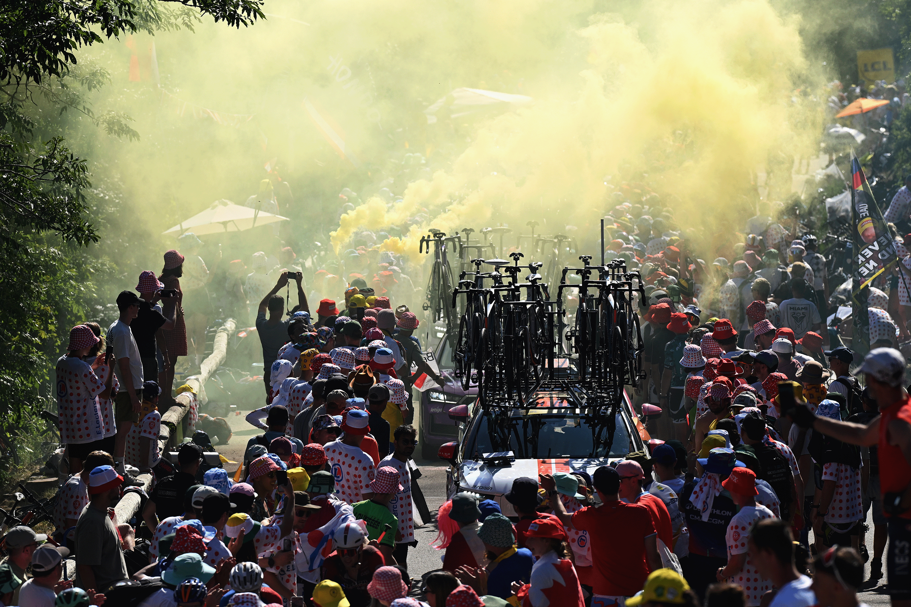 ALPE D'HUEZ, FRANCE - JULY 24: The team cars in the Alpe d'Huez (1835m) while fans cheers during the 113th Tour de France 2026, Stage 19 a 127.9km stage from Gap to Alpe d'Huez 1835m / #UCIWT / on July 24, 2026 in Alpe d'Huez, France. (Photo by Dario Belingheri/Getty Images)