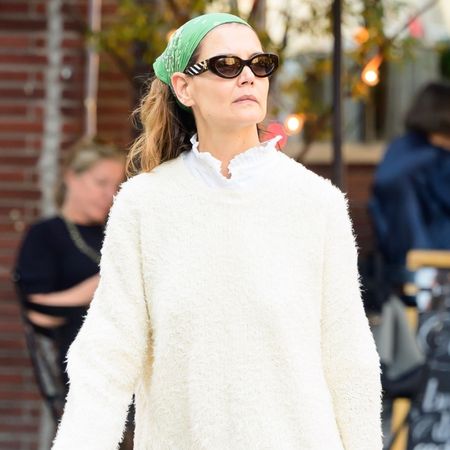 Katie Holmes was spotted in quirky color combinations, plus purple pinstripe pirate pants, ballet flats, and a tomato red bag