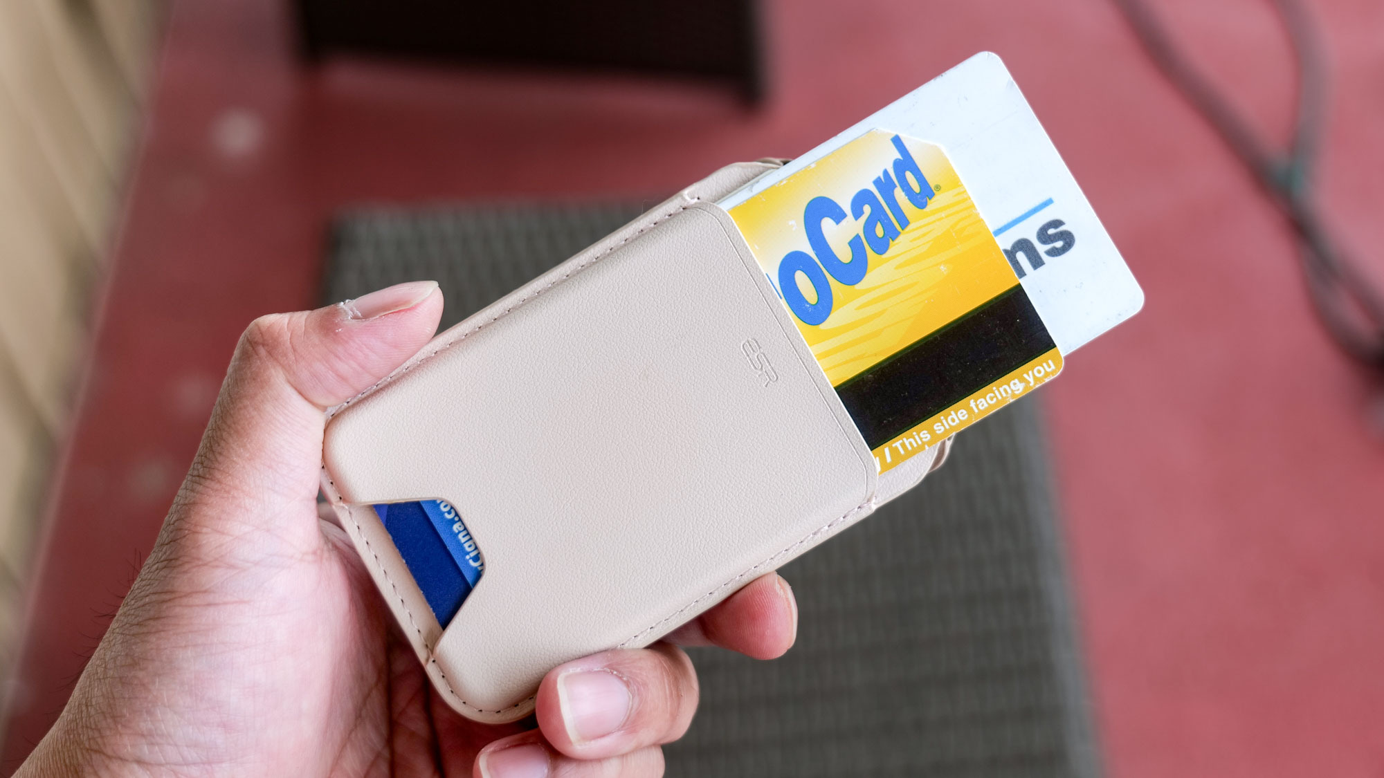 ESR Aura MagSafe Wallet in hand.