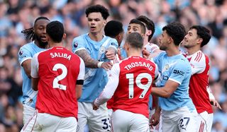 Players of Arsenal and Manchester City clash during the Premier League match between Manchester City and Arsenal at Etihad Stadium on April 19, 2026 in Manchester, England