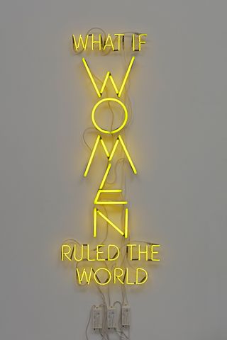 Yellow neon text-based sculpture