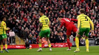 LIVERPOOL, ENGLAND - JANUARY 28: Virgil van Dijk captain of Liverpool scoring the fourth goal making the score 4-1 during the Emirates FA Cup Fourth Round match between Liverpool and Norwich City at Anfield on January 28, 2024 in Liverpool, England. (Photo by Andrew Powell/Liverpool FC via Getty Images)