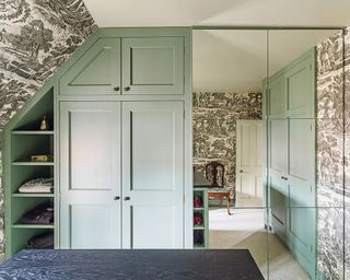 Small bedroom storage ideas illustrated by a built in mint green wardrobe.