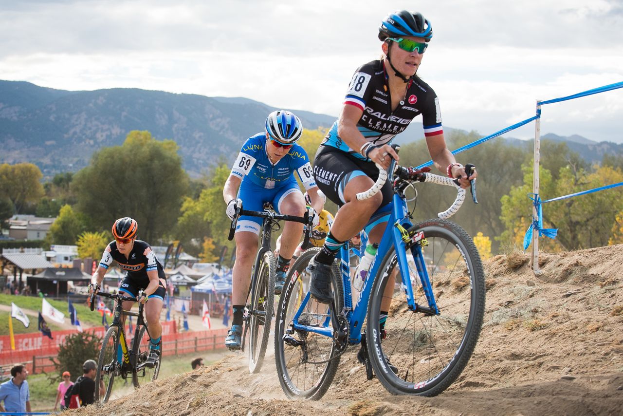 Caroline Mani (Raleigh Clement), Georgia Gould (Luna) round a off camber turn during the opening lap of the race.