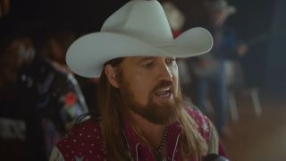 Billy Ray Cyrus singing in the music video for "Old Town Road"