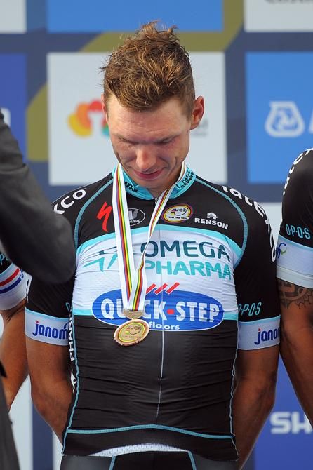 Tony Martin looks down at the bronze medal. It's not a colour he's used to seeing these days