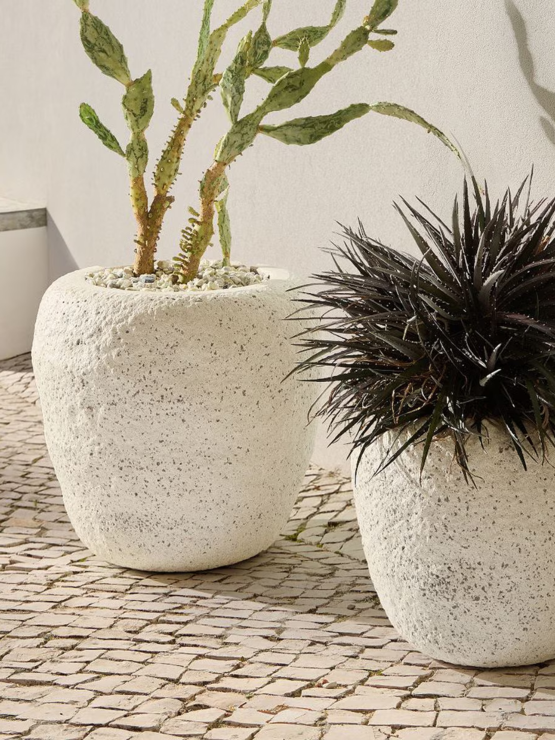 A textured white stone planter from West Elm
