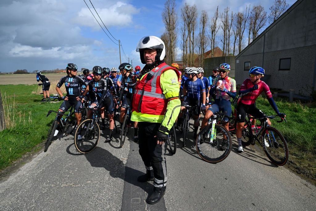 DE PANNE BELGIUM MARCH 23 The peloton stops because the race has been neutralised after the accident in the 6th Exterioo Womens Classic BruggeDe Panne 2023 a 1631km one day race from Brugge to De Panne UCIWWT on March 23 2023 in De Panne Belgium Photo by Luc ClaessenGetty Images