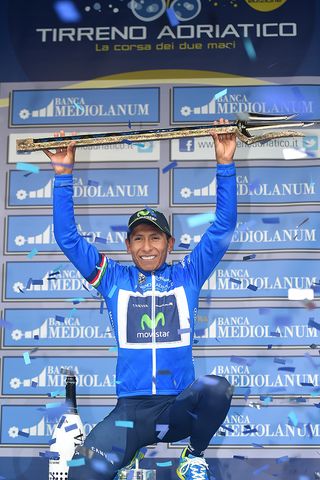Nairo Quintana holds his trident aloft