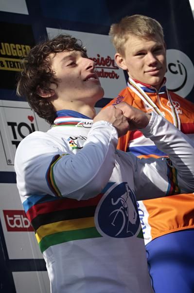 Tomas Paprstka (Czech Republic) zips up his rainbow jersey