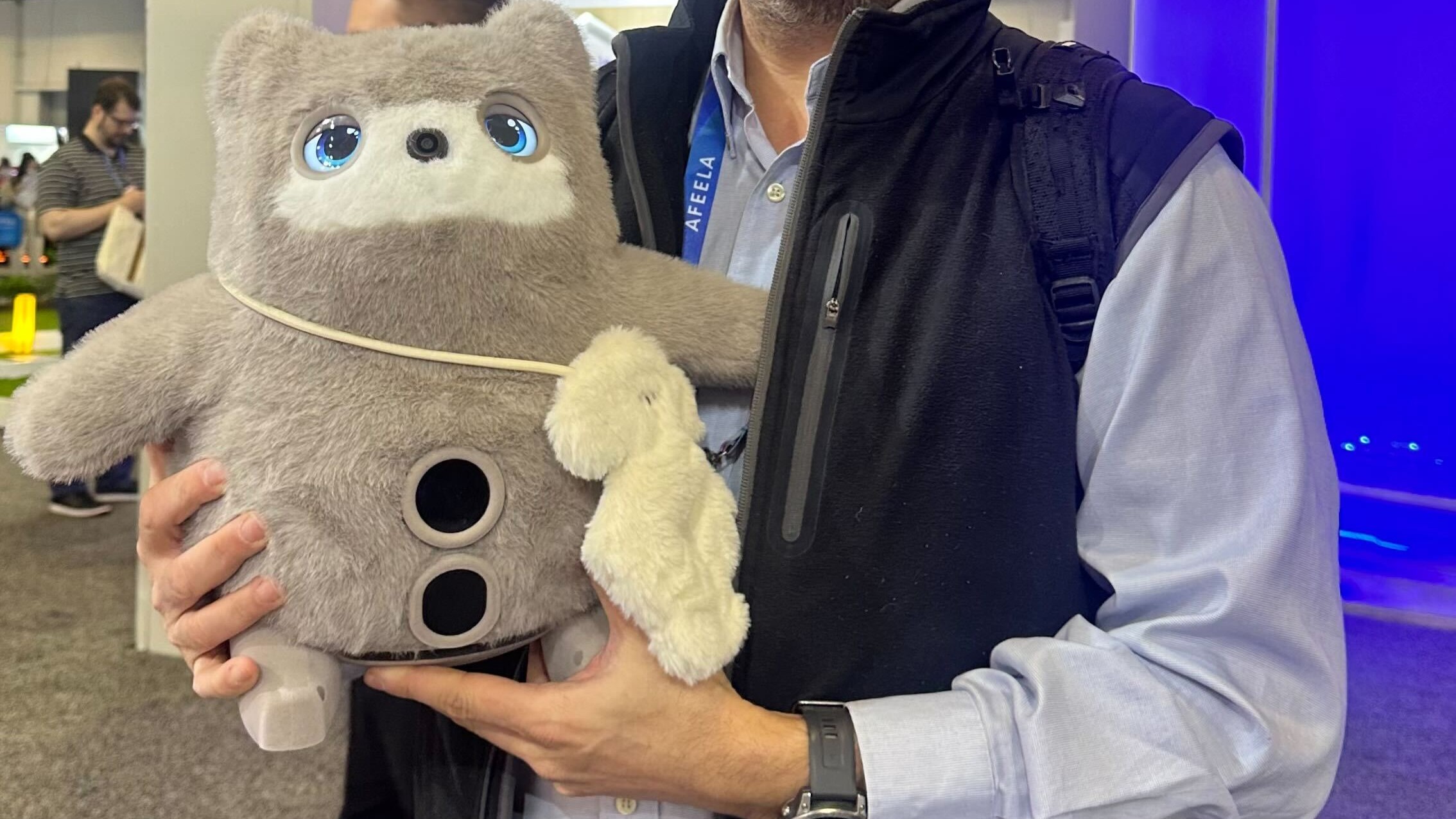A SwitchBot Kata Friend robot companion in hand at CES