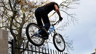Danny MacAskill riding a fence in Edinburgh