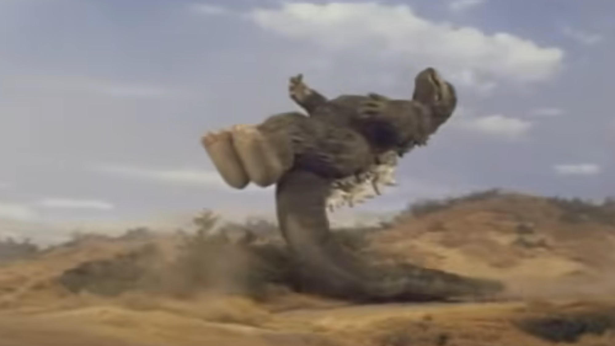 Godzilla doing his famous tail slide in Godzilla vs. Megalon