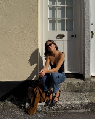 @_jessicaskye wearing woven leather flats and jeans