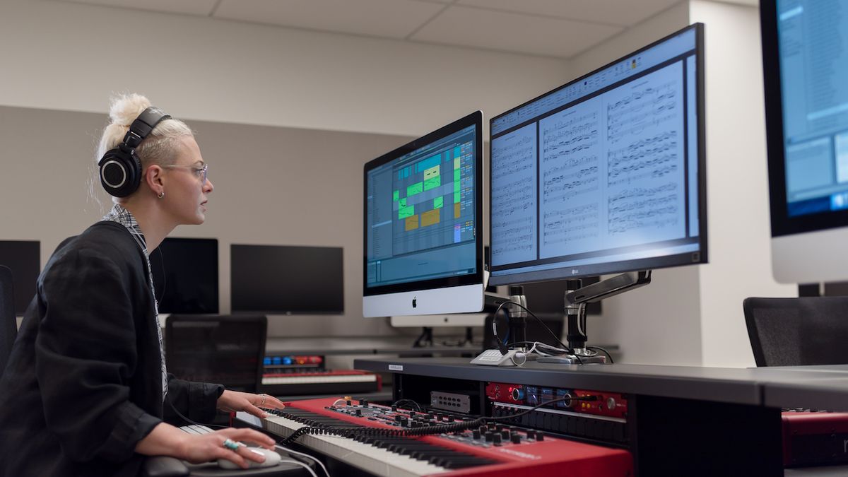 A student working in Bowes Lab at San Francisco Conservatory of Music, featuring Focusrite RedNet X2P 2x2 Dante audio interface