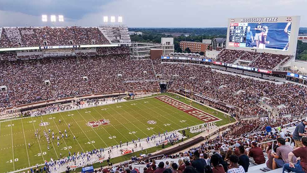 A look at Mississippi State fans cheering as football plays across the Daktronics LED display in the end zone. 