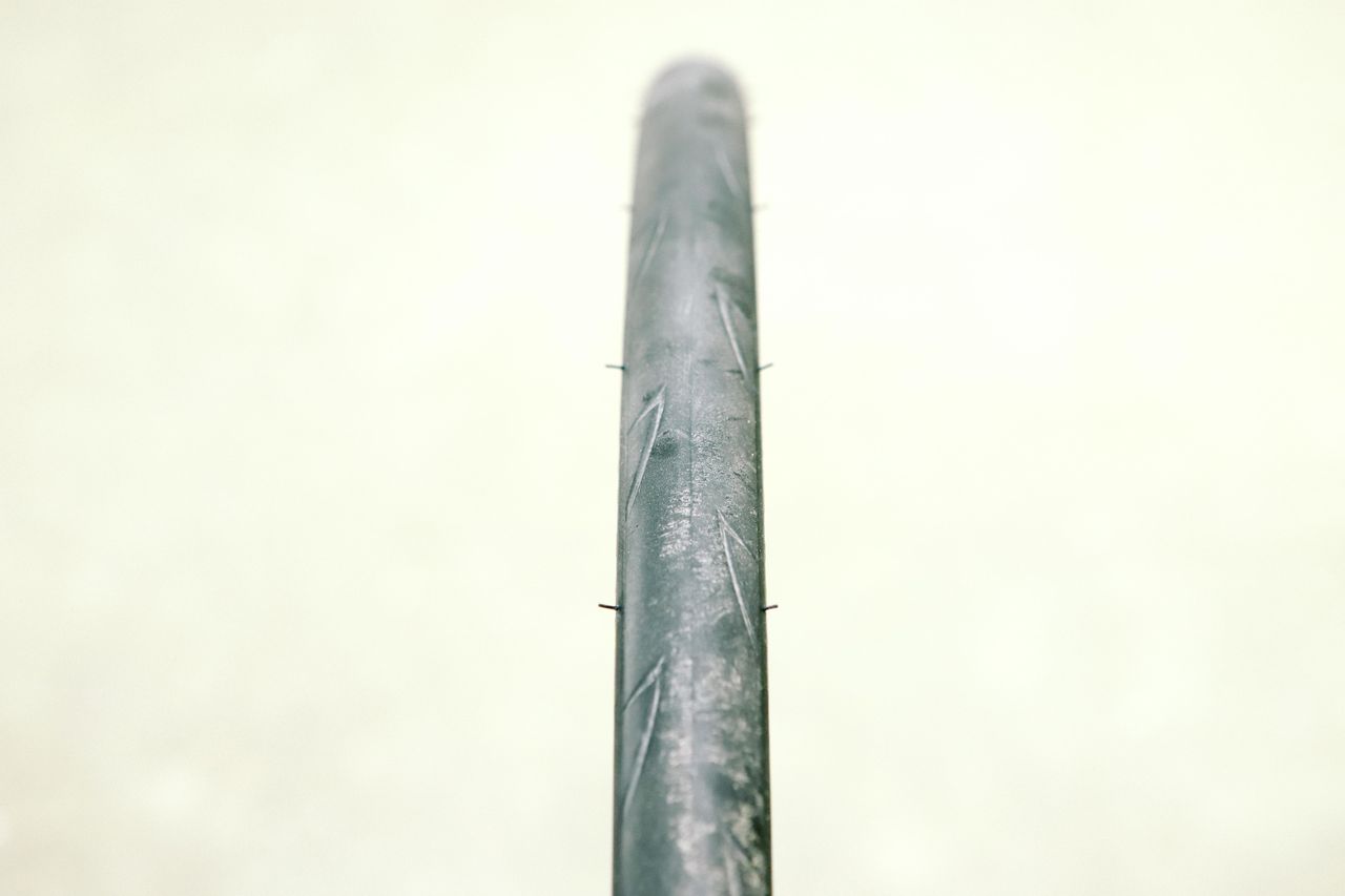 a close up of a black road bike tyre