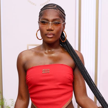 Doechii wears a Miu Miu bandana top with a matching skirt at the 2025 BET Awards.