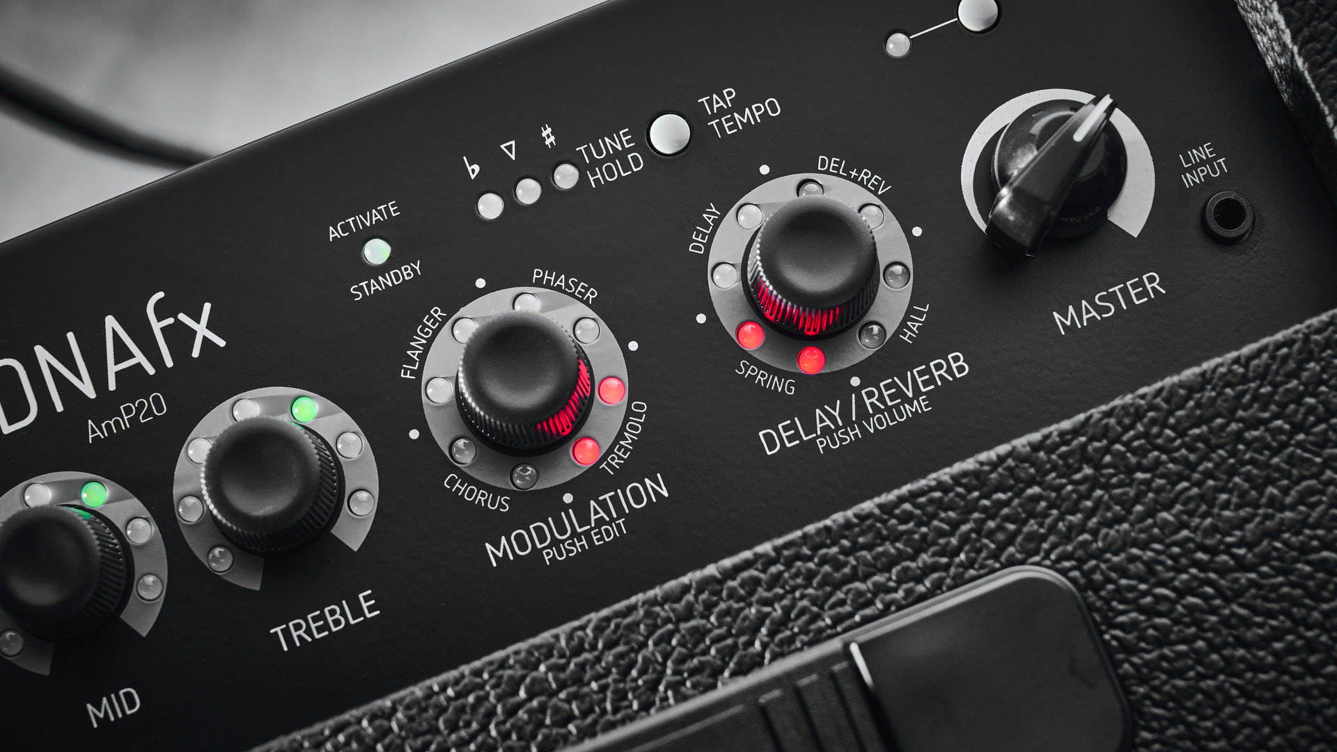 Harley Benton DNAFX AmP20: the compact 1/8&quot; modelling combo is finished in black and photographed in close-up and against a slate floor