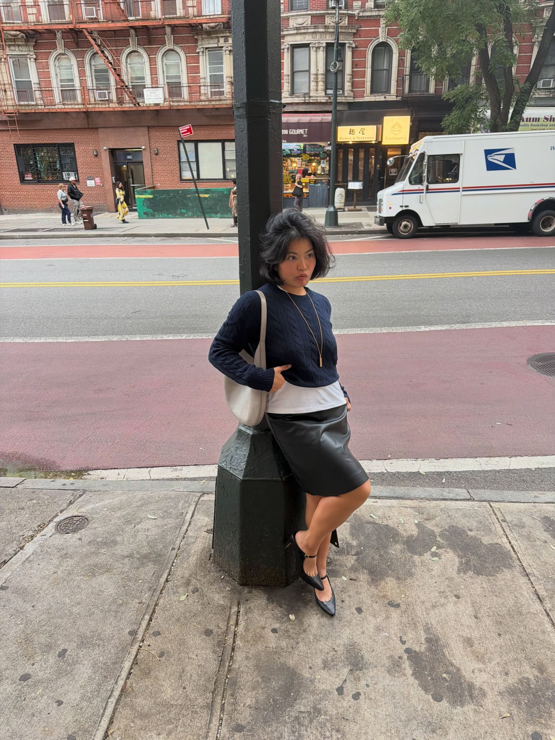A woman wearing a fall sweater outfit in 2026.