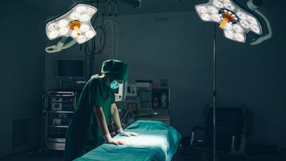 healthcare worker standing in an operating room