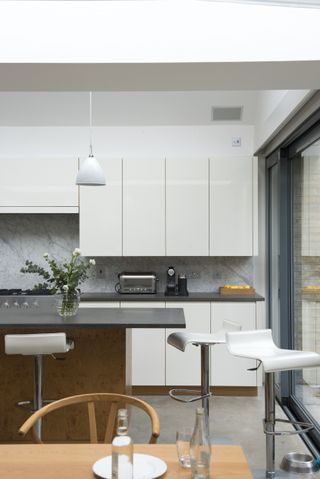 A white kitchen with gloss finish cabinetry